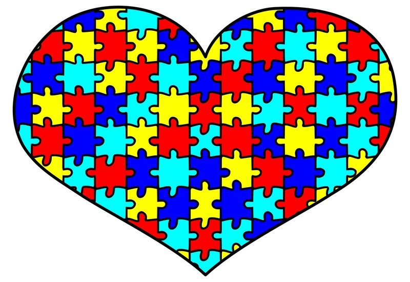 Imagem de um coração colorido e dentro dele há peças de um quebra-cabeça.